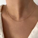 Collier à pois