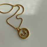 Collar con medalla redonda del zodiaco